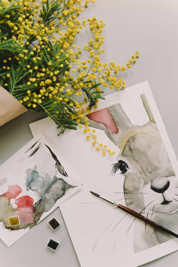 Easter-themed watercolor painting featuring a bunny and fresh mimosa flowers.